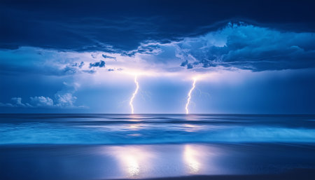 Dramatic seascape with vibrant lightning bolts illuminating twilight sky over calm ocean. Reflections shimmer on water's surface. Long-exposure photography creates serene yet powerful atmosphereの素材