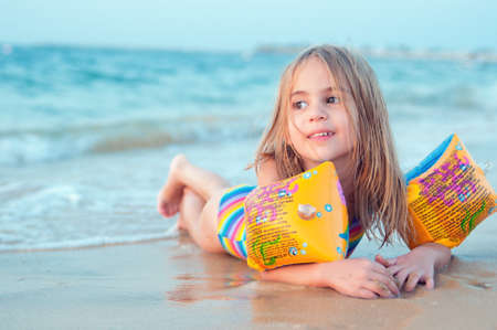 Sea vacation happiness Happy cute little girl on beachの写真素材