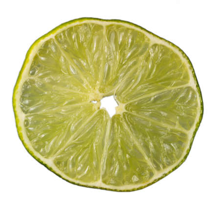 Slice of an isolated green lemon (lat. Citrus) - Eureka