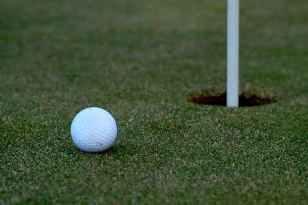 Golf Ball by holeの写真素材