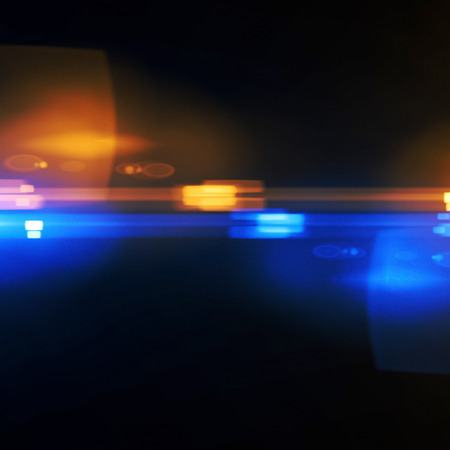 Beautiful light flares. Glowing streaks on dark background. Luminous abstract sparkling lined...
