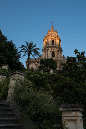 The cathedral f Ragusa Sicily, built in late baroque style, with the sunset lightの写真素材