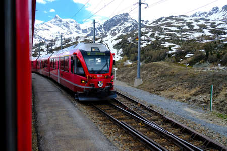 The red Bernina express with Swiss mountains