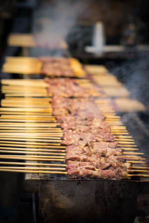 A typical central Italy dish: lamb "arrosticini". They are thin skewers of mutton cooked on the grillの写真素材