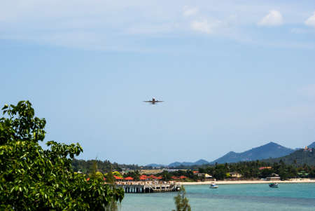 Front view of the aircraft taking off from the Samui airport, located on the beachの写真素材