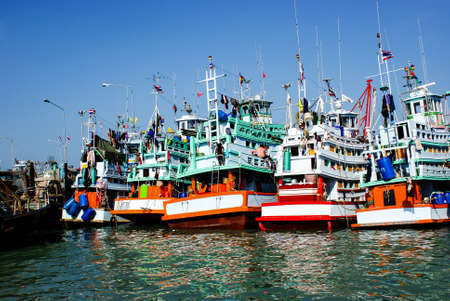 Several fishing ships moored in the portの写真素材