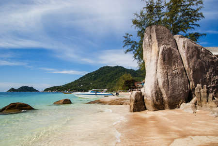 Relax on a deserted beach in an island of Tropical paradise. Sand Sairee beach  with huge stones  at  Koh Tao, Thailandの写真素材