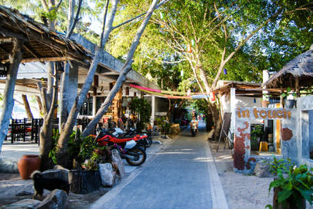 KOH TAO, THAILAND, Island life. A pedestrian street along the coast of Sayri beach is sometimes used by motorcyclesの写真素材