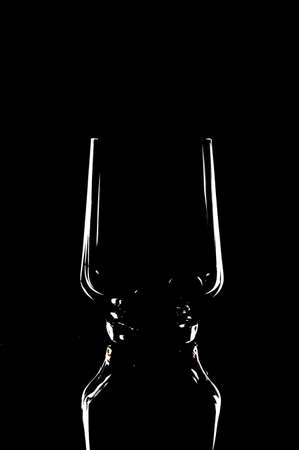 contour t on a wine-glass glass empty on a black backgroundの写真素材