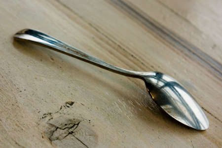 spoon on a wooden tableの写真素材