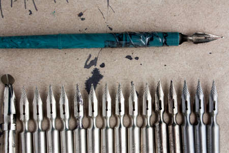 pens on old paper with blotsの写真素材