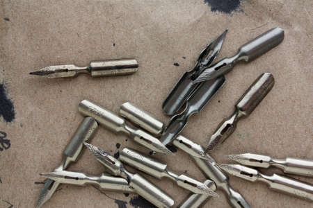 pens on old paper with blotsの写真素材