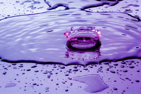 drop in color water surface splash of water crownの写真素材
