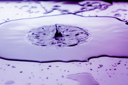 drop in color water surface splash of waterの写真素材