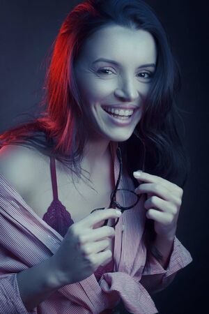 Fashionable Artistic Portrait Of A Beautiful Female Model In Bright Lights