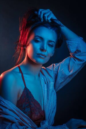 Fashionable Artistic Portrait Of A Beautiful Female Model In Bright Lights.