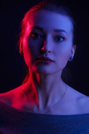 Fashionable Artistic Portrait Of A Beautiful Female Model In Bright Lights.