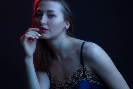 Fashionable Artistic Portrait Of A Beautiful Female Model In Bright Lights. Color gel photography Inspoの写真素材