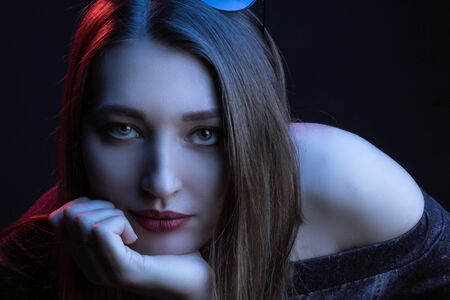 Fashionable Artistic Portrait Of A Beautiful Female Model In Bright Lights. Color gel photographyの写真素材