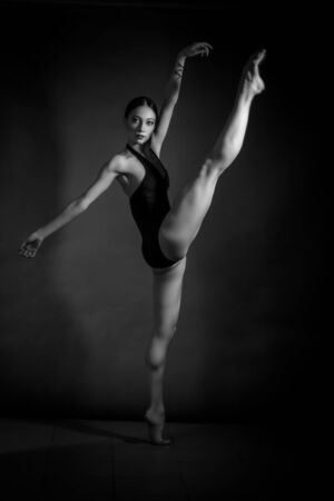 black and white vintage dramatic portrait of a dancing girl-ballerinaの写真素材
