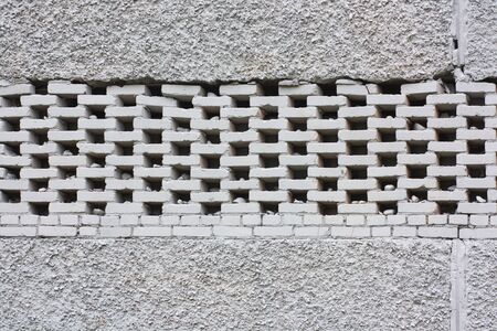 White brick wall background. Neutral texture of a flat brick wall close-up.の写真素材