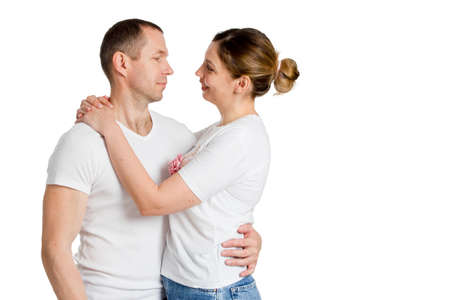 Portrait of a loving couple embracing. Isolated on white.
