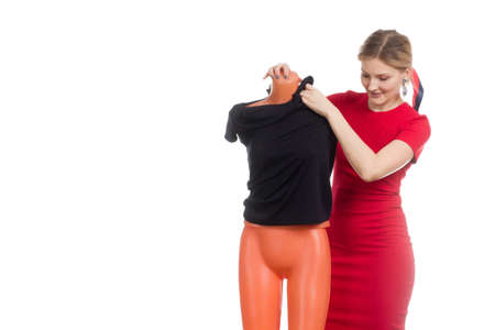 A young woman on a white background, in a red dress,の写真素材