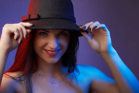 Fashionable Artistic Portrait Of A Beautiful Female Model In Bright Lights.