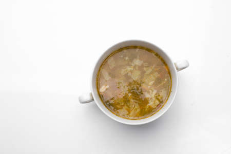 Green Sorrel soup with Boiled meat On a White Table, Horizontal top view from aboveの写真素材