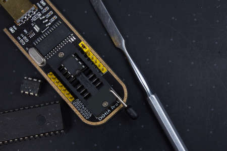 programmer with inserted microchip memory. electronics repairの写真素材