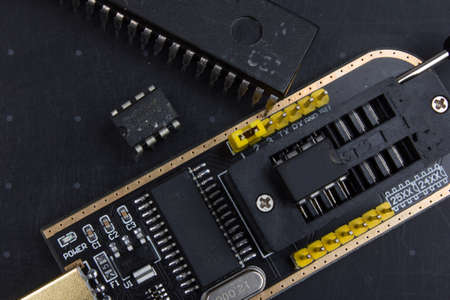 programmer with inserted microchip memory. radio electronics repair