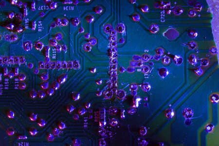 Electronic board in colored blue light. Abstract Image