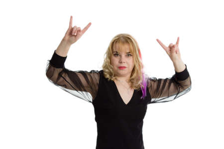 blonde woman doing rock symbol with hands up. Music star. Heavy music concept. white isolatedの写真素材