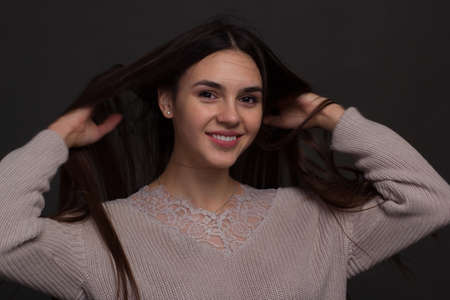 portrait of a young woman with long brown hair.