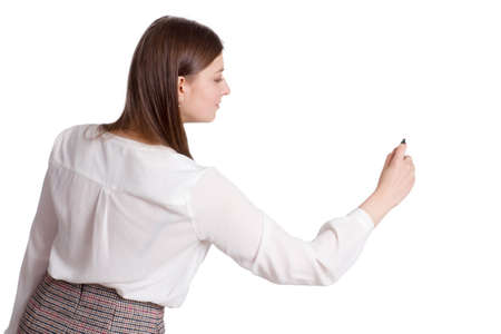 portrait of a young businesswoman in a white shirt and plaid skirt .. writes with a marker with copy spaceの写真素材