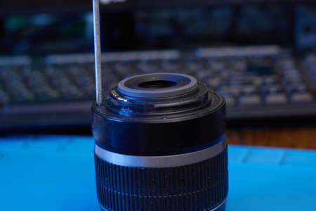 We disassemble the lens with screwdriver closeupの写真素材