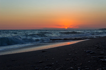 Sunset on the beach of the Baltic Sea in Kolobrzegの写真素材