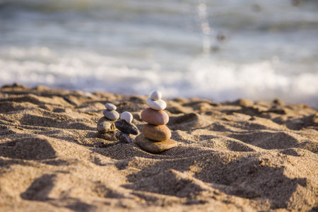 Pyramid of pebbles on the beach. Zen concept.の写真素材