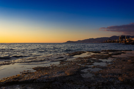 Sunset on the Mediterranean coast in Tarragona, Spainの写真素材