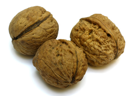 walnuts beans, roasted, close up isolated on white background