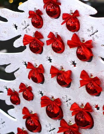 White Christmas close up tree with red balls bulbs Happy New Years decoration backgroundの写真素材