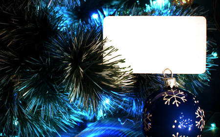 Background for Christmas or New Year greetings card. Blue colors with copyspace blank card.