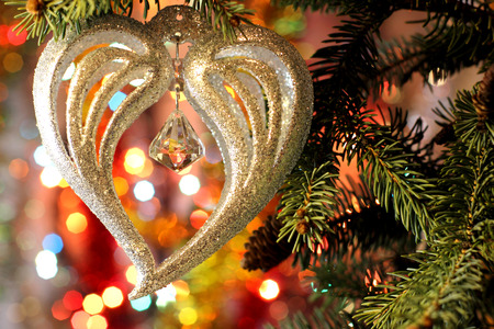 Style New Years and Christmas Eve celebration background with a Heart decoration elegant arrangement clock counting down to midnight, New Year`s tree brunch. Copyspace. Bokeh light garland backdrops.の写真素材