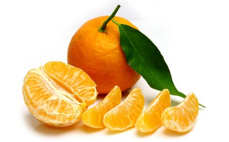 Mandarin, tangerine citrus fruit, with green leaf, isolated on white background. Pile of a fresh citrus.の写真素材