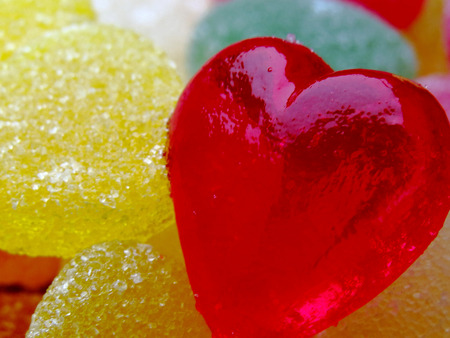 A beautiful red heart candies coated with sugar.  Love colorful sweet candies, hearts shaped candy 14 februaryの写真素材