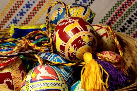 Handmade colored Easter eggs on traditional Ukrainian cloth backgroundの写真素材