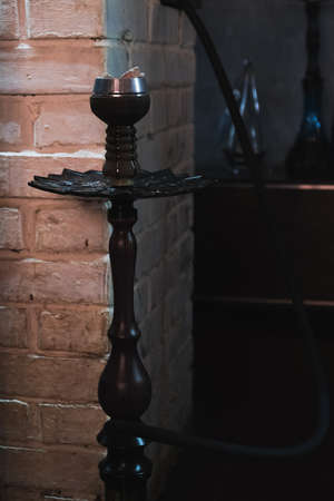 brick wall smoking hookah