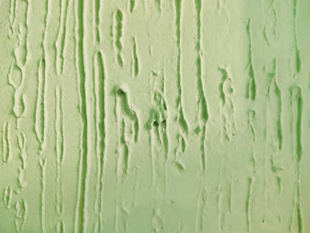 green painted wall, decorative plaster with place for textの写真素材