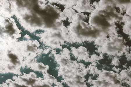many white clouds in the blue dramatic sky