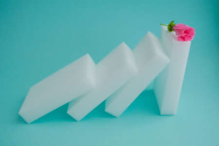 melamine sponges for washing and cleaning and pink flowerの写真素材